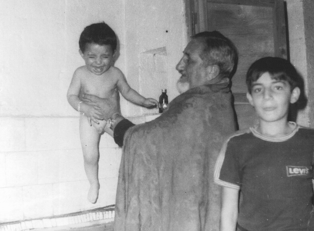 From the baptism ceremony of Albert Tokac, the grandson of Ironsmith Miran Demir, held by Priest Varak Beyleryan at Surp Giragos Church in 1979. (The archive of Ergün Ayık)